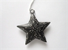 Et stk. sort/mørkgrå jule Drawing stjerne.  8,5 cm. til ophæng.